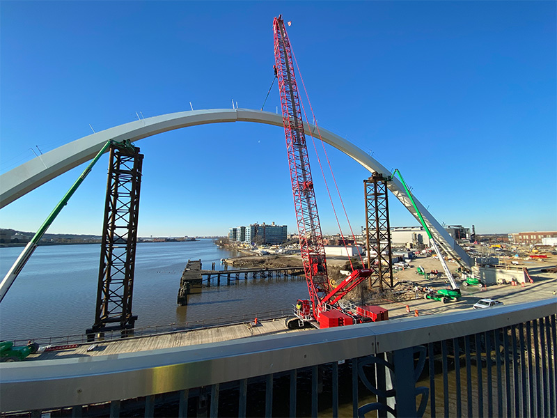 Slings being used to lift heavy bridge piece in washington DC